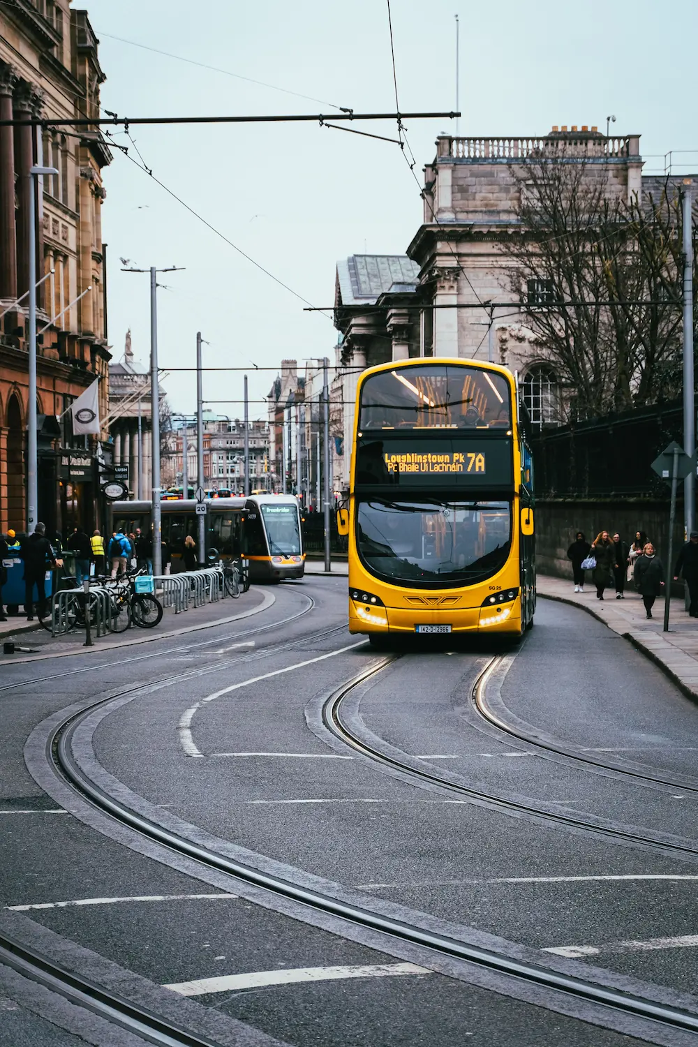 A Dublin Bus and Luas tram operating together, showing the city's integrated public transport network